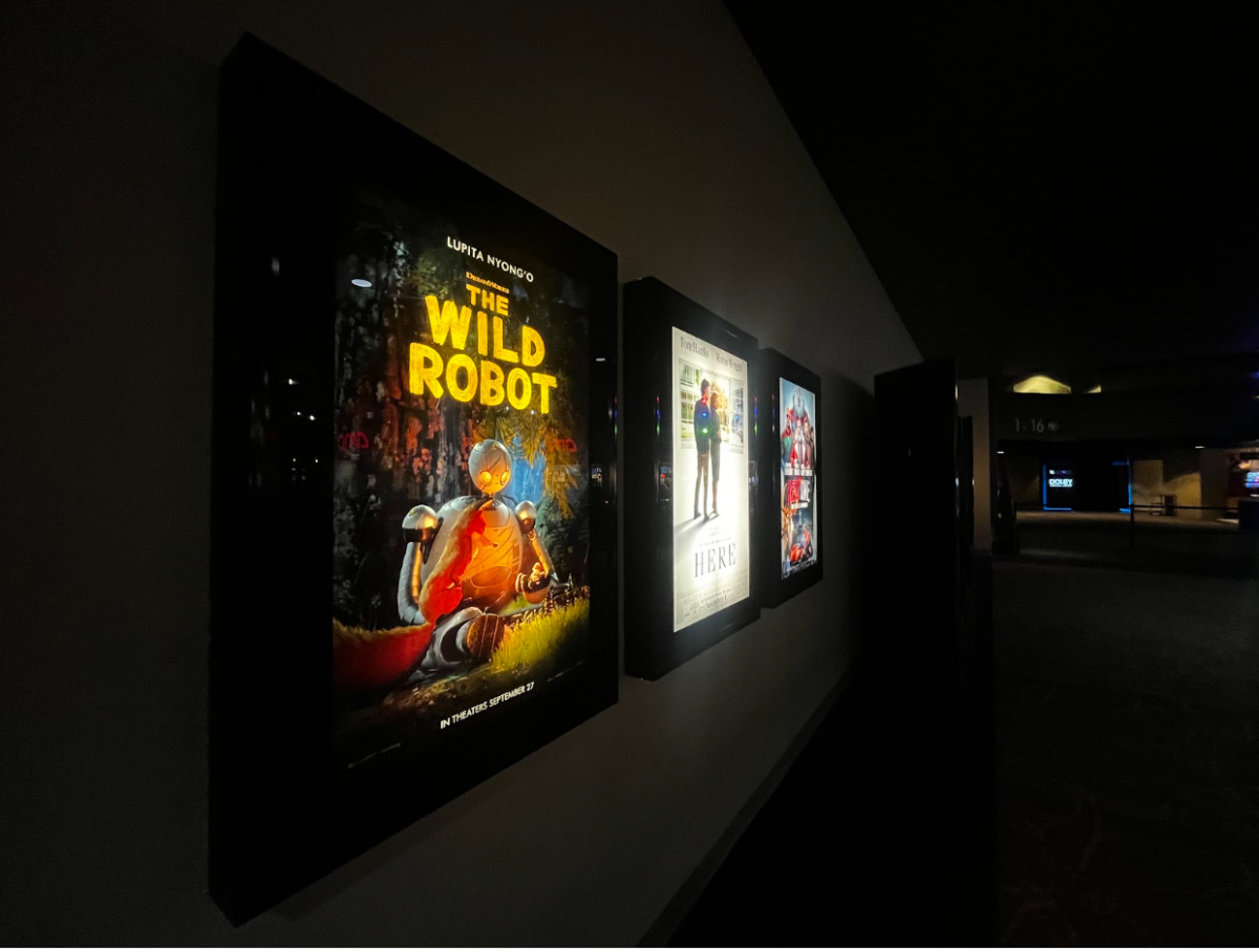 A poster for The Wild Robot at the AMC Theater. This movie is an adaptation of the Wild Robot Books by Peter Brown.
